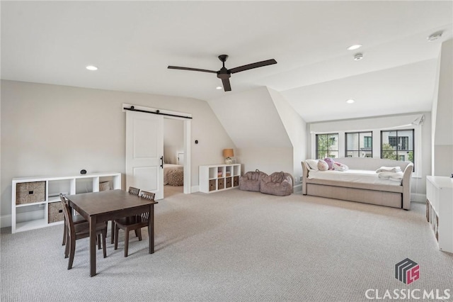 1170 Broadpoint Dr, Greensboro, GA 30642 - bedroom with a barn door, light colored carpet, vaulted ceiling, recessed lighting, and ceiling fan