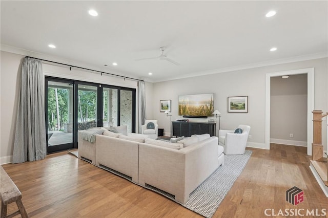 1170 Broadpoint Dr, Greensboro, GA 30642 - living area featuring ornamental molding, recessed lighting, baseboards, light wood-type flooring, and a ceiling fan