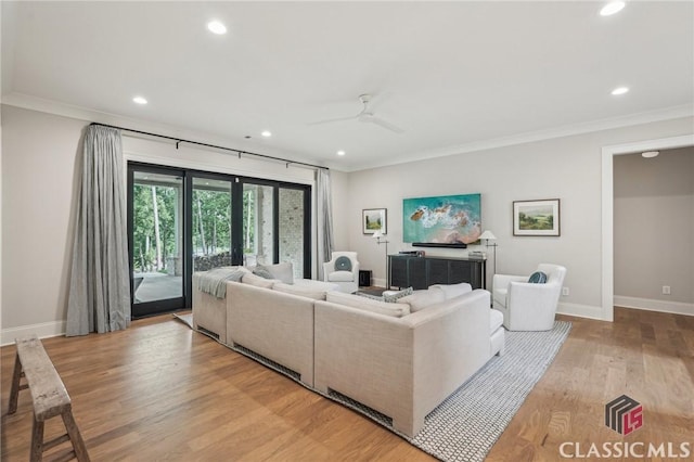 1170 Broadpoint Dr, Greensboro, GA 30642 - living room with recessed lighting, ornamental molding, light wood finished floors, baseboards, and ceiling fan
