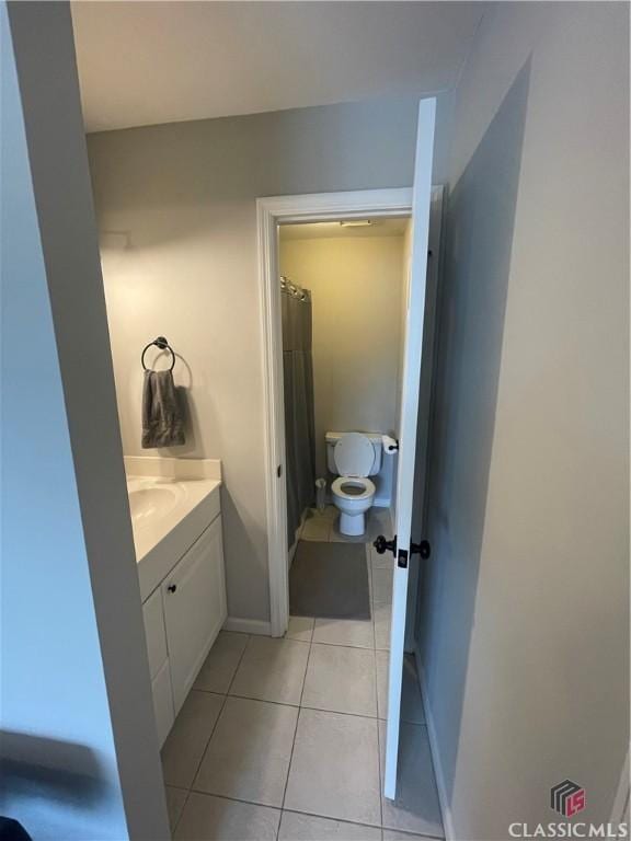 2165 Milledge Dr S, Athens, GA 30605 - full bathroom with tile patterned floors, vanity, toilet, and baseboards