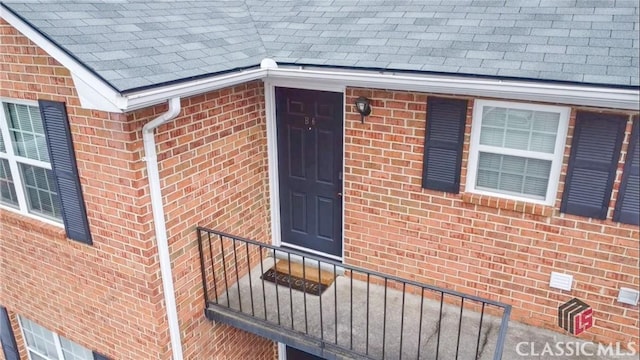 2165 Milledge Dr S, Athens, GA 30605 - view of exterior entry featuring a shingled roof and brick siding