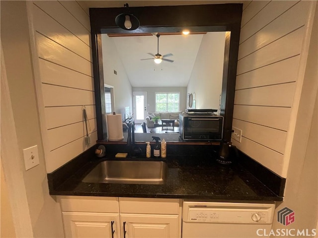 2165 Milledge Dr S, Athens, GA 30605 - kitchen featuring white dishwasher, a sink, a ceiling fan, dark stone counters, and white cabinets