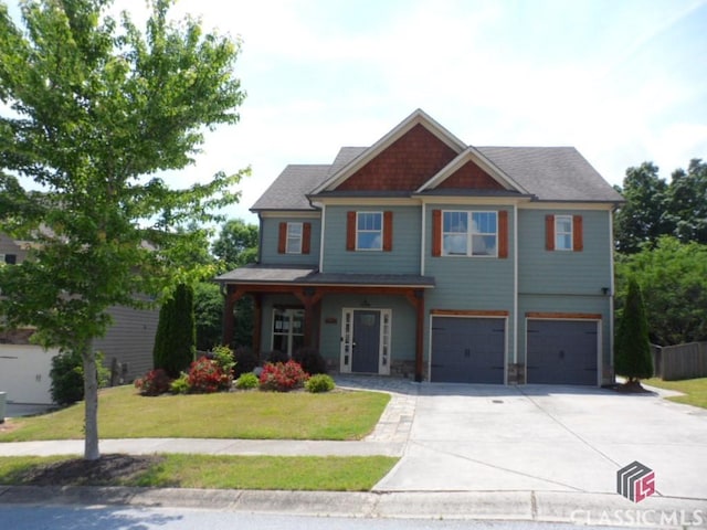 628 Holliman Cir, Pendergrass, GA 30567 - craftsman inspired home with driveway, a garage, a front yard, and covered porch