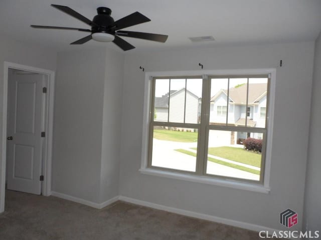 628 Holliman Cir, Pendergrass, GA 30567 - unfurnished room featuring plenty of natural light, baseboards, light carpet, and a ceiling fan