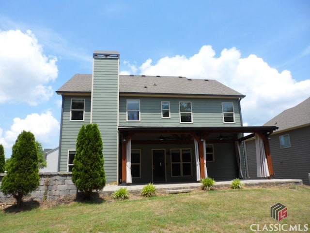 628 Holliman Cir, Pendergrass, GA 30567 - rear view of property with a lawn, a ceiling fan, a patio, and a chimney