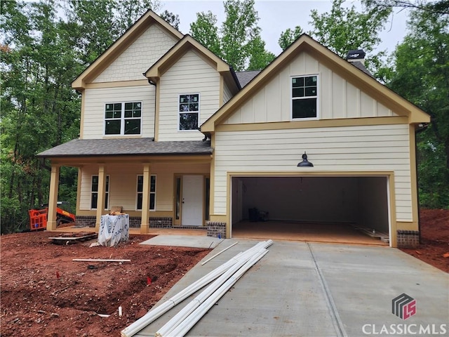 350 Discovery Trl, Athens, GA 30605 - craftsman-style house with concrete driveway, a porch, roof with shingles, and board and batten siding