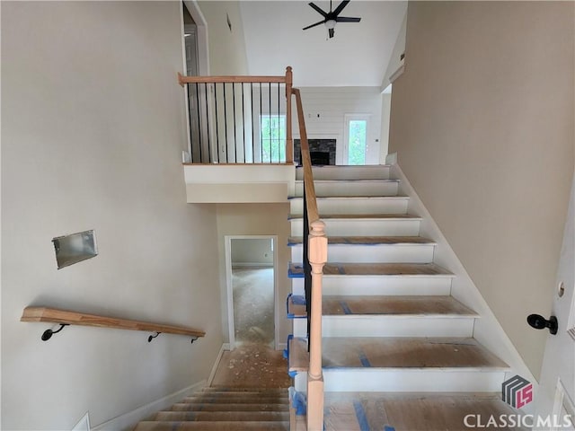 355 Discovery Trl, Athens, GA 30605 - stairway featuring a towering ceiling, a ceiling fan, and baseboards