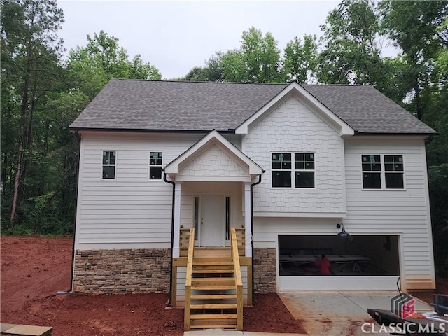 365 Discovery Trl, Athens, GA 30605 - view of front of property featuring roof with shingles, stone siding, an attached garage, and concrete driveway