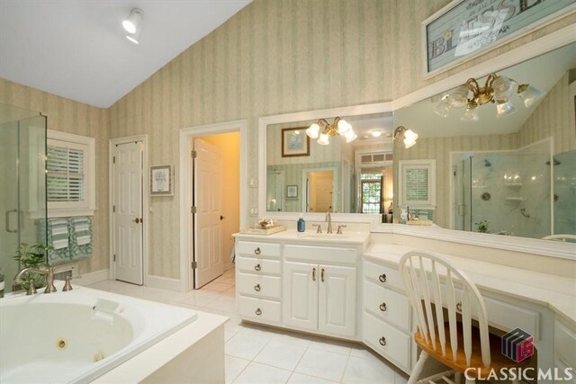 416 Mcdaniel St, Monroe, GA 30655 - full bath with wallpapered walls, a stall shower, tile patterned flooring, a chandelier, and a tub with jets