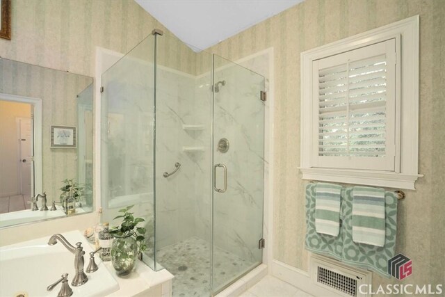416 Mcdaniel St, Monroe, GA 30655 - full bathroom with wallpapered walls, a marble finish shower, a bath, a sink, and tile patterned flooring