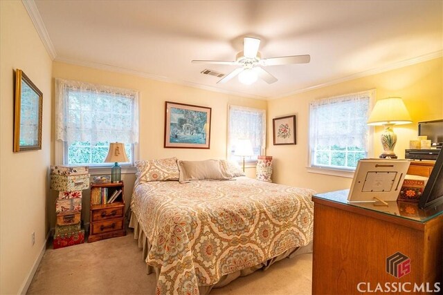 416 Mcdaniel St, Monroe, GA 30655 - bedroom with light colored carpet, crown molding, and ceiling fan