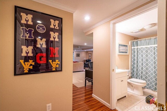 416 Mcdaniel St, Monroe, GA 30655 - hallway featuring ornamental molding, wood finished floors, recessed lighting, and baseboards