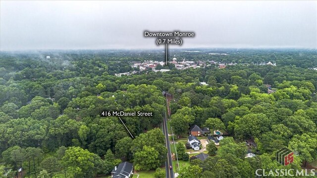 416 Mcdaniel St, Monroe, GA 30655 - view of property location with property boundaries highlighted and a heavily wooded area