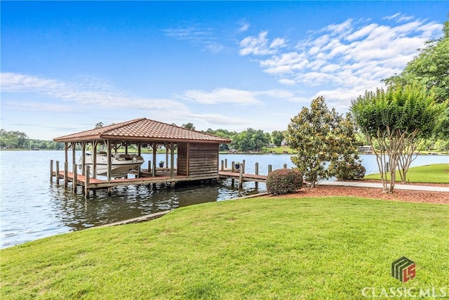 112 Dogwood Pt, Eatonton, GA 31024 - dock with boat lift, a lawn, and a water view