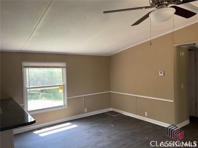117 Lombardy Dr, Athens, GA 30601 - unfurnished living room with wood finished floors, a ceiling fan, a textured ceiling, baseboards, and vaulted ceiling