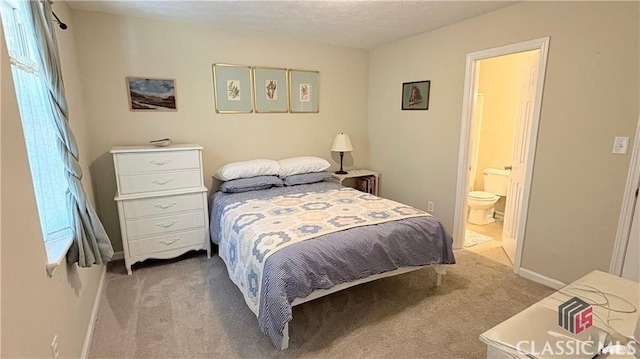 210 Big Oak Cir, Athens, GA 30605 - bedroom featuring light colored carpet, baseboards, and ensuite bath