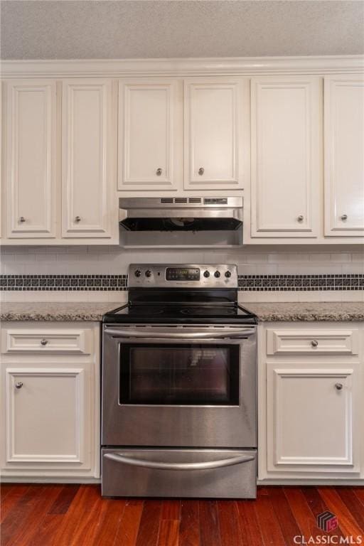 4080 Derby, Cumming, GA 30040 - kitchen with electric range, under cabinet range hood, white cabinets, and decorative backsplash