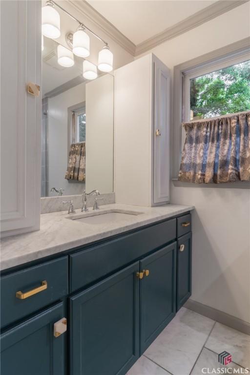 4080 Derby, Cumming, GA 30040 - bathroom with vanity, crown molding, baseboards, and tile patterned flooring