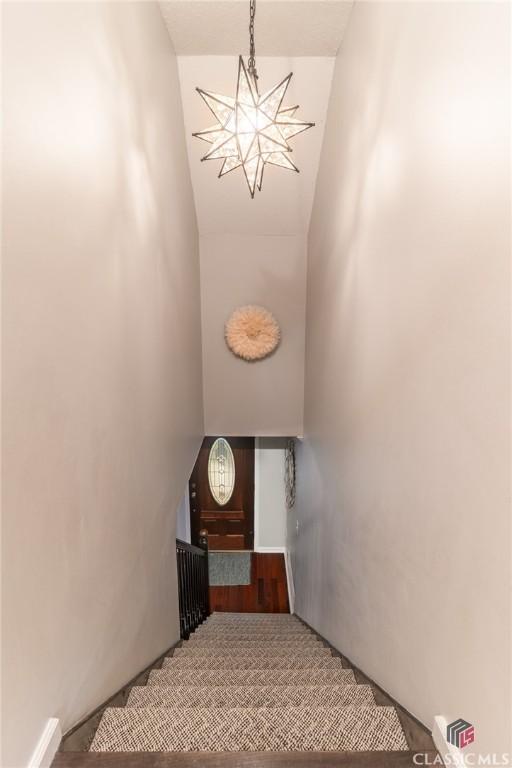 4080 Derby, Cumming, GA 30040 - staircase featuring a chandelier