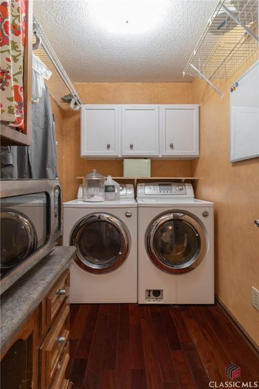 4080 Derby, Cumming, GA 30040 - washroom with washer and dryer, cabinet space, dark wood-style floors, and a textured ceiling