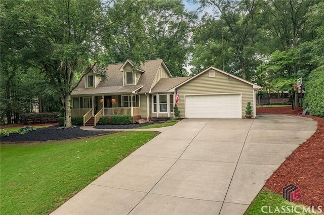 4080 Derby, Cumming, GA 30040 - cape cod home with covered porch, an attached garage, driveway, a front yard, and view of scattered trees