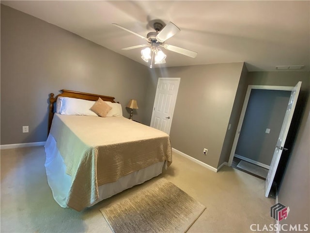 1100 Roberta Dr, Bishop, GA 30621 - bedroom featuring light carpet, baseboards, and a ceiling fan