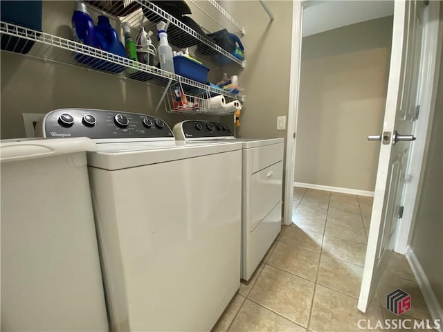 1100 Roberta Dr, Bishop, GA 30621 - washroom with separate washer and dryer, light tile patterned flooring, and baseboards