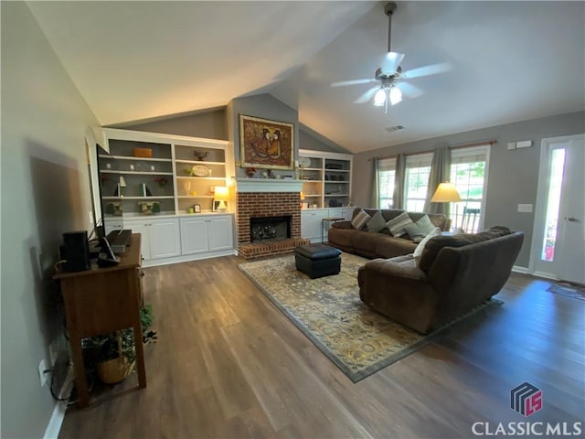 1100 Roberta Dr, Bishop, GA 30621 - living area featuring vaulted ceiling, dark wood-style flooring, ceiling fan, a fireplace, and baseboards