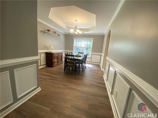 1100 Roberta Dr, Bishop, GA 30621 - dining area featuring a decorative wall, a raised ceiling, crown molding, a chandelier, and dark wood-style flooring