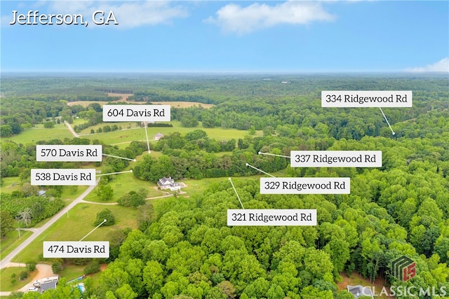 570 Davis Rd, Jefferson, GA 30549 - aerial view of property and surrounding area with a heavily wooded area and property parcel outlined