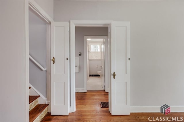 170 Stanton, Athens, GA 30606 - hallway featuring wood finished floors, baseboards, and stairway
