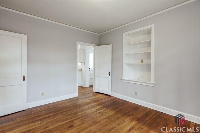 170 Stanton, Athens, GA 30606 - spare room featuring ornamental molding, baseboards, wood finished floors, and built in features