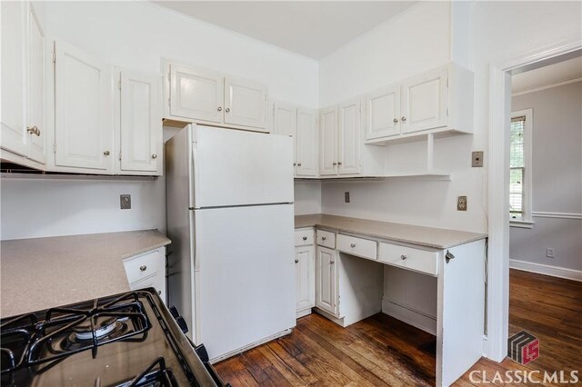 170 Stanton, Athens, GA 30606 - kitchen featuring freestanding refrigerator, dark wood-style floors, white cabinets, light countertops, and crown molding
