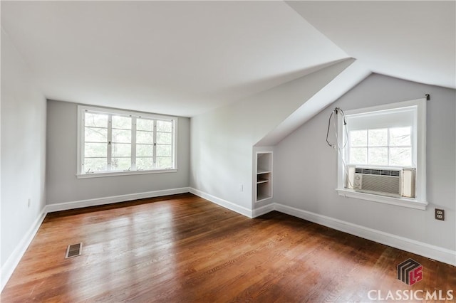 170 Stanton, Athens, GA 30606 - additional living space with plenty of natural light, wood finished floors, vaulted ceiling, built in shelves, and cooling unit