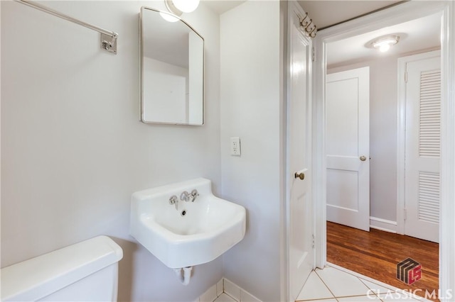 170 Stanton, Athens, GA 30606 - bathroom featuring toilet, wood finished floors, baseboards, and a sink