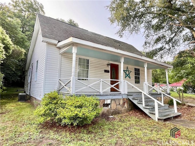 180 N Poplar St, Athens, GA 30601 - view of front facade with a porch, roof with shingles, and cooling unit