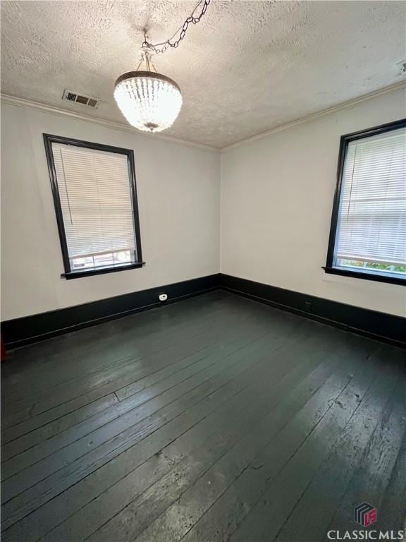 180 N Poplar St, Athens, GA 30601 - spare room with a textured ceiling, hardwood / wood-style flooring, and ornamental molding