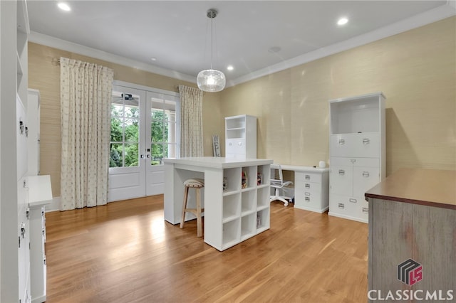 710 Cox Rd, Milton, GA 30075 - kitchen with open shelves, light wood finished floors, a kitchen bar, decorative light fixtures, and ornamental molding