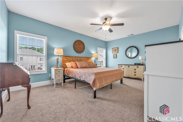 1810 Willow Creek Dr, Watkinsville, GA 30677 - carpeted bedroom with multiple windows, baseboards, and ceiling fan
