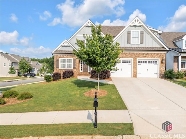 1810 Willow Creek Dr, Watkinsville, GA 30677 - craftsman-style house featuring brick siding, board and batten siding, a front lawn, driveway, and an attached garage