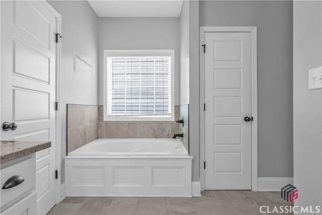 1810 Willow Creek Dr, Watkinsville, GA 30677 - full bath featuring a garden tub, vanity, and tile patterned floors