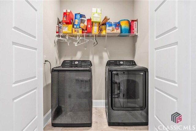 1810 Willow Creek Dr, Watkinsville, GA 30677 - laundry room featuring independent washer and dryer, tile patterned flooring, and baseboards