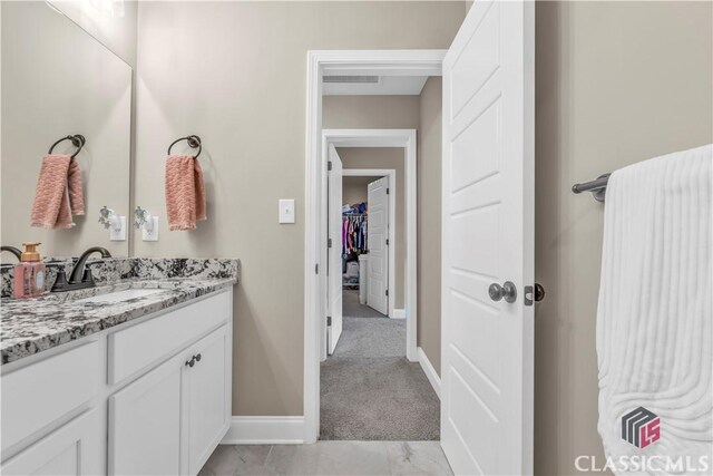 1810 Willow Creek Dr, Watkinsville, GA 30677 - bathroom with vanity and baseboards