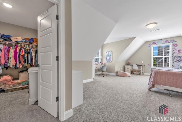 1810 Willow Creek Dr, Watkinsville, GA 30677 - bedroom featuring carpet, baseboards, lofted ceiling, and a walk in closet