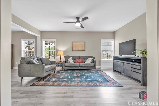 1810 Willow Creek Dr, Watkinsville, GA 30677 - living area featuring wood finished floors, ceiling fan, and baseboards