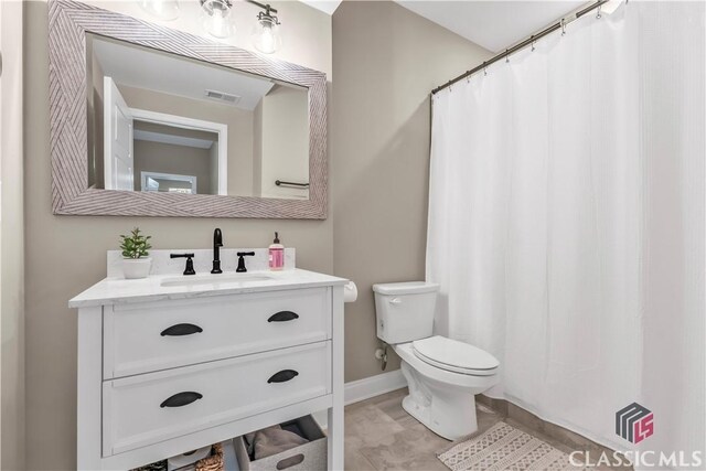 1810 Willow Creek Dr, Watkinsville, GA 30677 - full bath with toilet, vanity, and baseboards