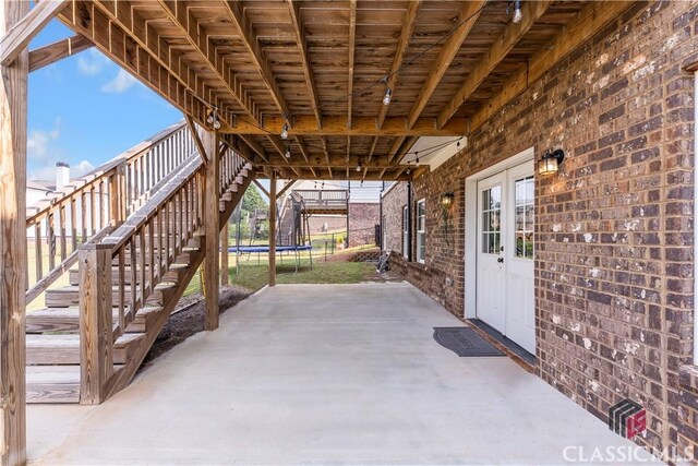 1810 Willow Creek Dr, Watkinsville, GA 30677 - view of patio featuring a trampoline and stairs