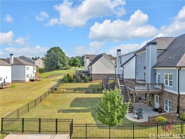1810 Willow Creek Dr, Watkinsville, GA 30677 - view of yard featuring stairway, a patio area, a wooden deck, and a residential view