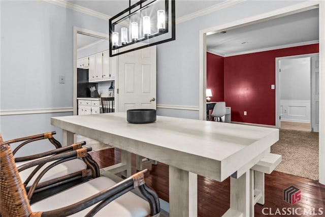 161 Pinecrest Ter, Athens, GA 30606 - kitchen featuring white cabinetry, a chandelier, ornamental molding, a kitchen breakfast bar, and a desk