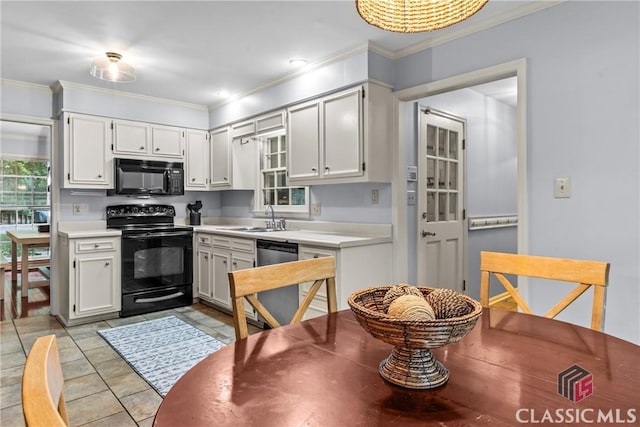 161 Pinecrest Ter, Athens, GA 30606 - kitchen with black appliances, ornamental molding, healthy amount of natural light, and light countertops